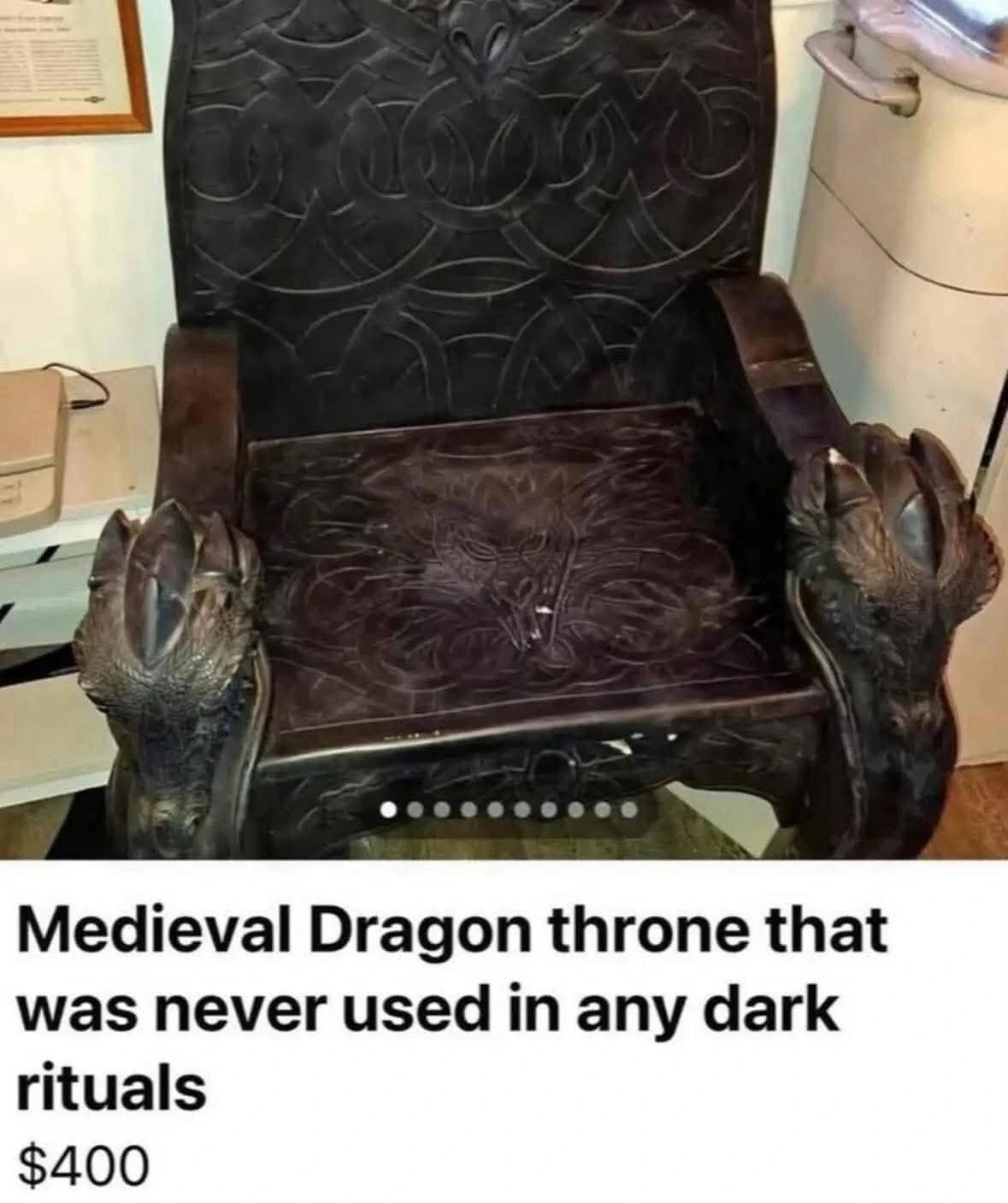 [A picture of a very fantasy-like wooden chair with dragon heads on the armrests and intricate dragon-head woodwork on the seat] Medieval Dragon throne that was never used in any dark rituals $400